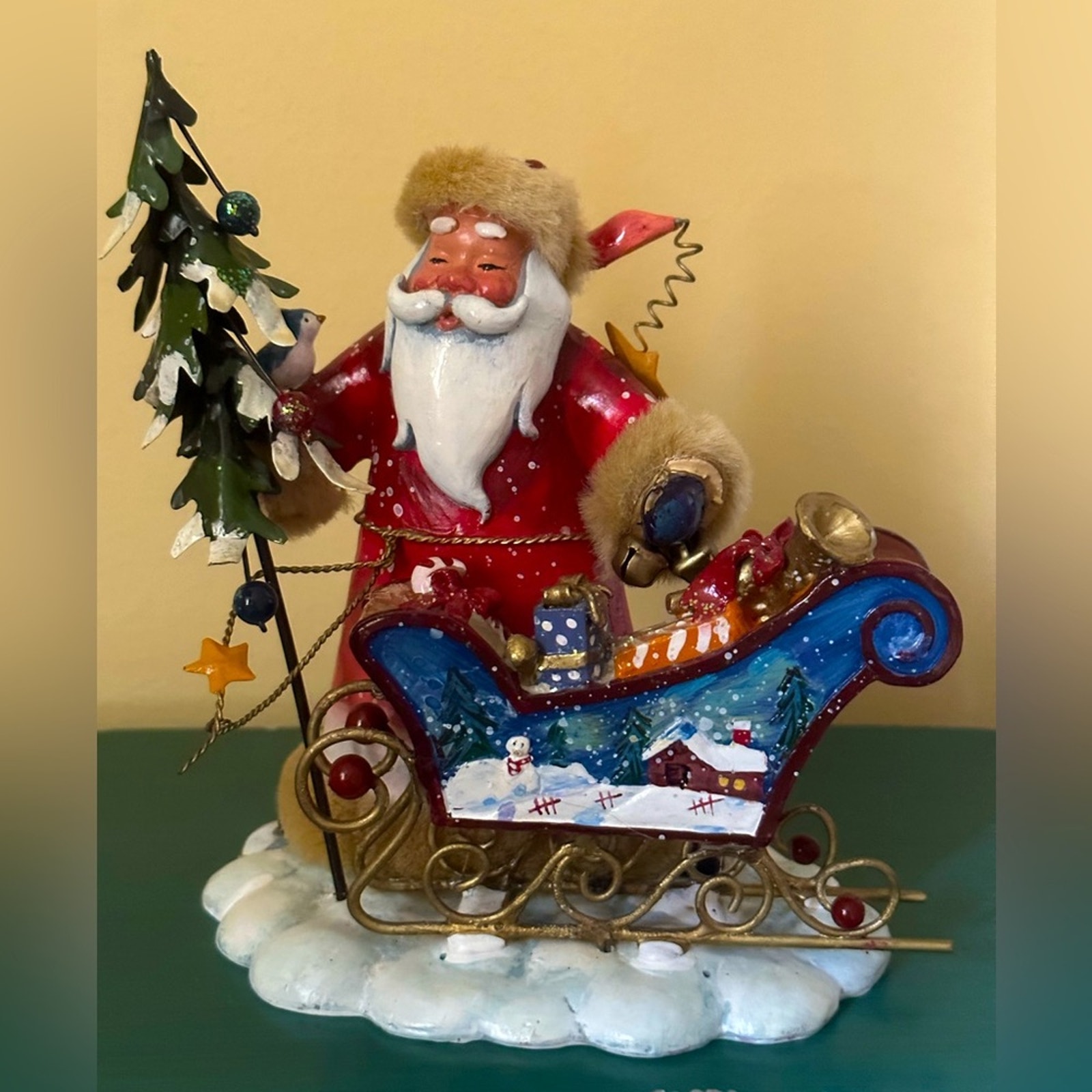 Vintage Santa detailed figurine with hand painted sleigh and jingle bells
