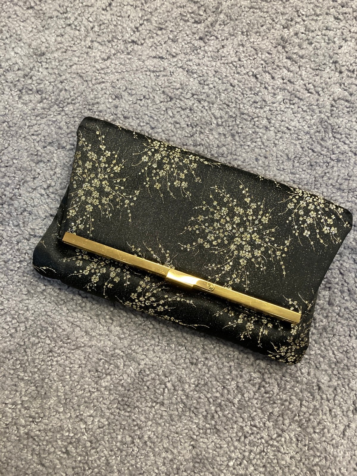 Vintage black and gold fold over clutch