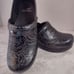 Dansko 38 black tooled leather clogs