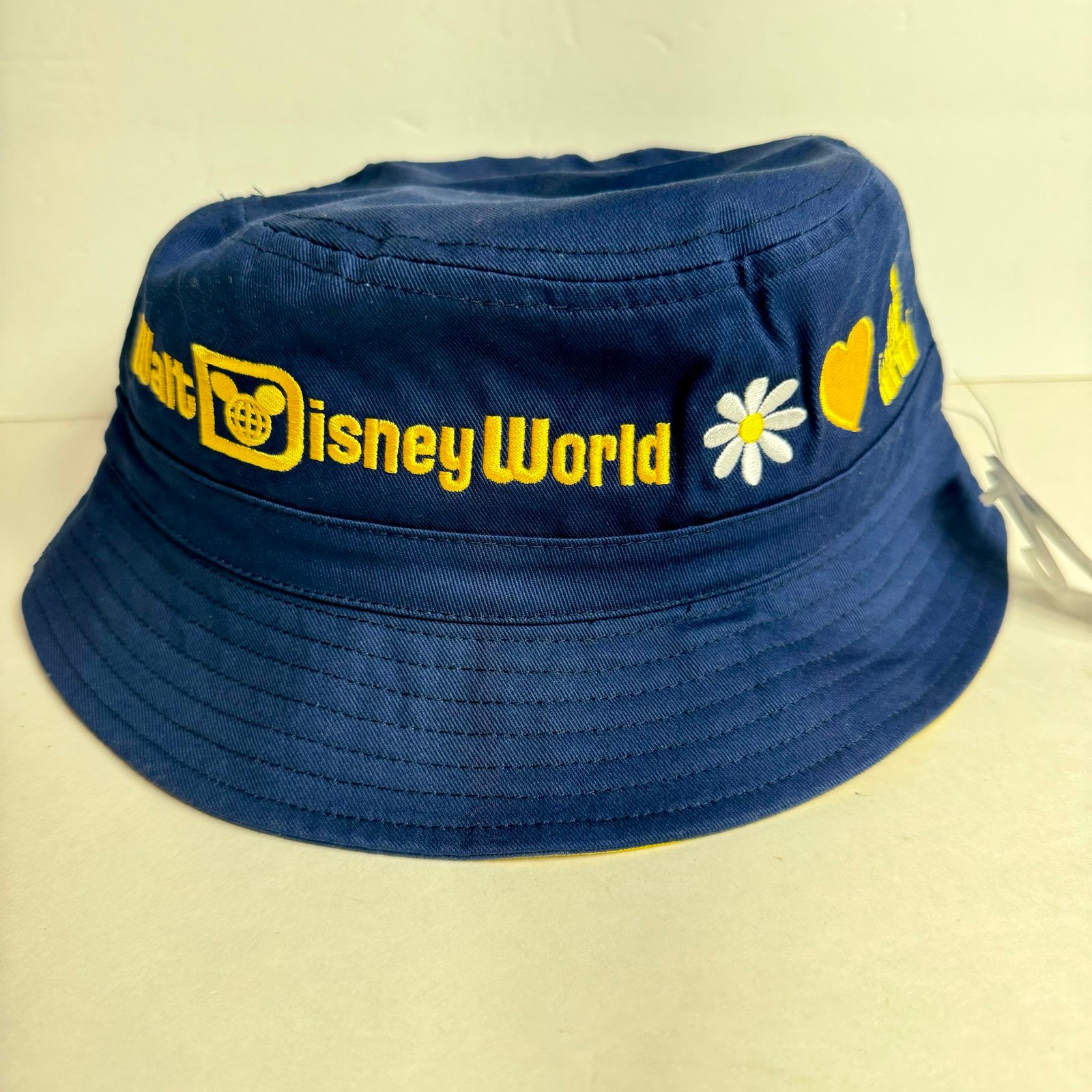 NWT. Disney Bucket Hat Walt Disney World Adult Blue Yellow Daisy Castle Heart