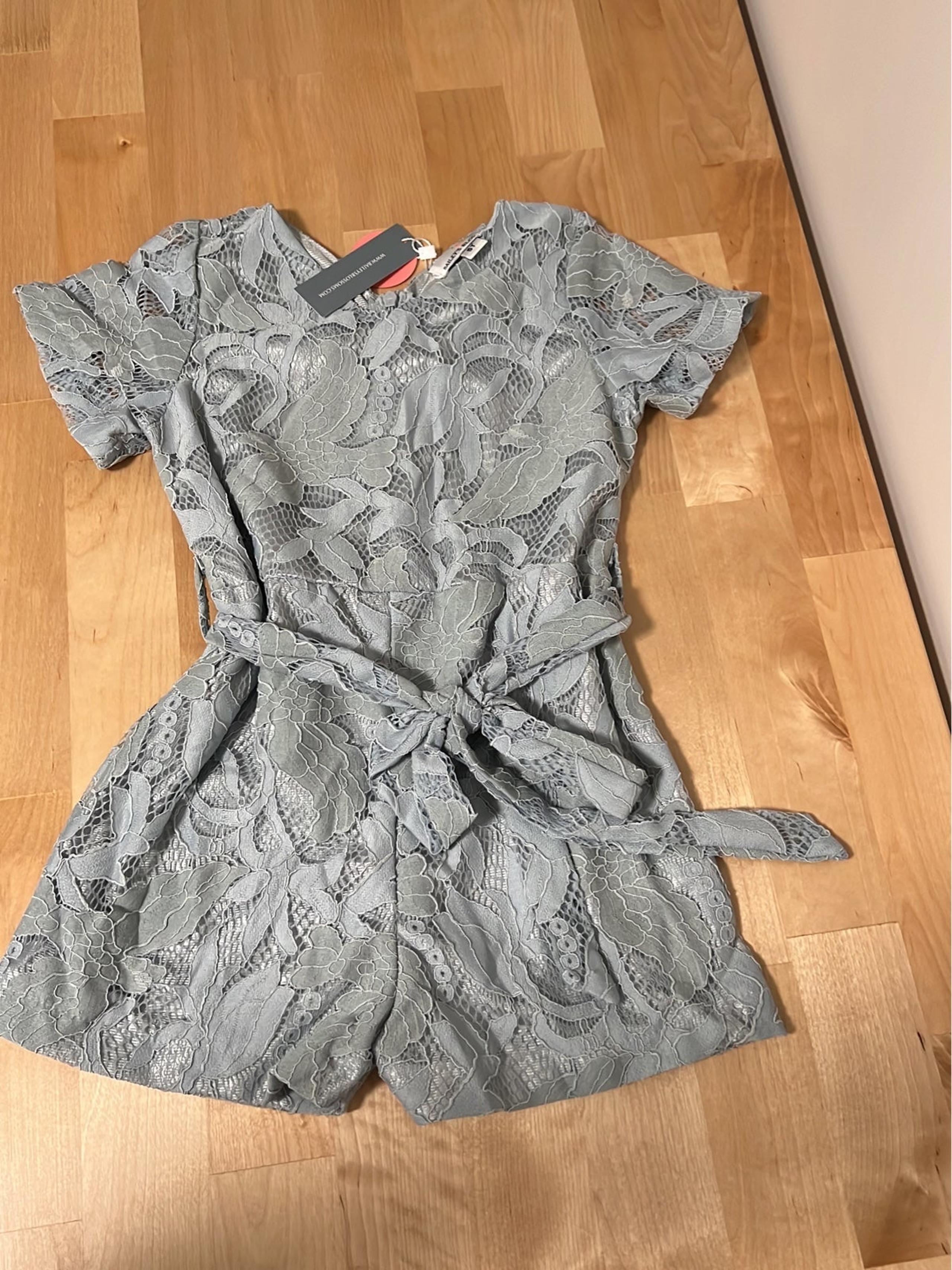 Blue floral Bailey’s Blossoms romper