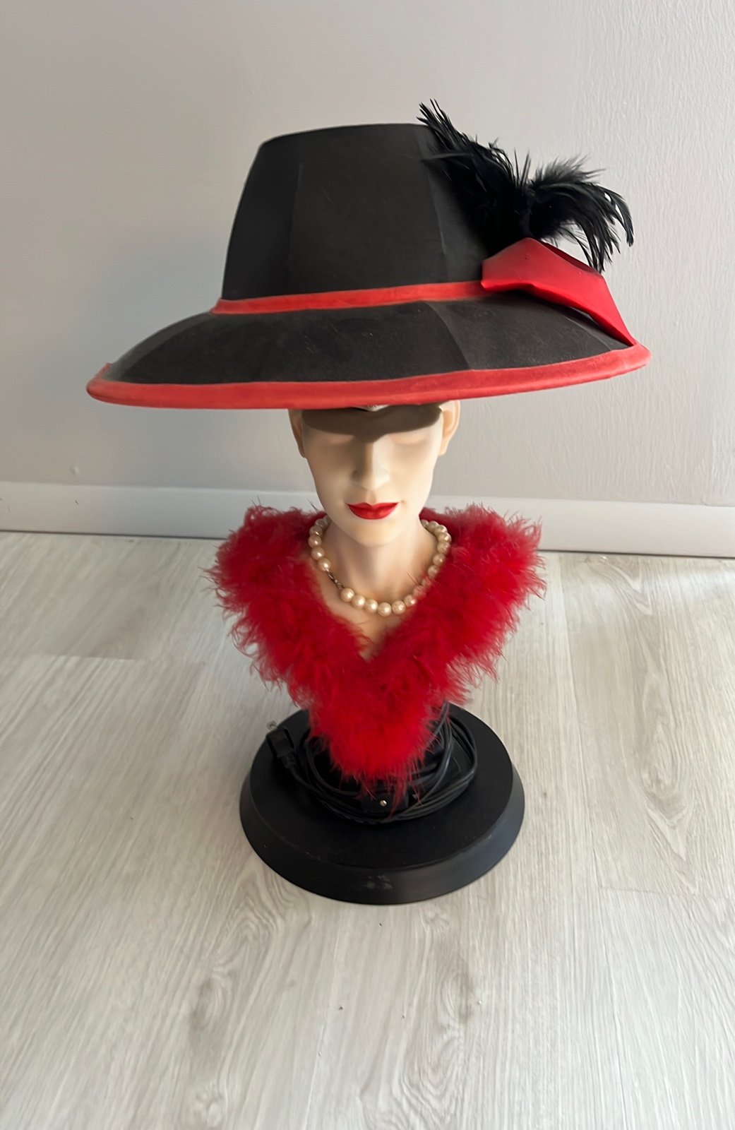A red and black table lamp
