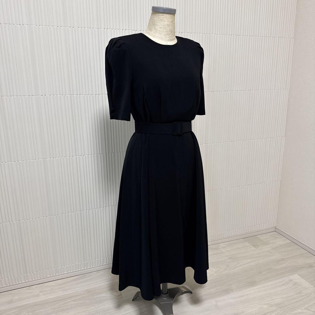 Flare skirt dress with black belt.
