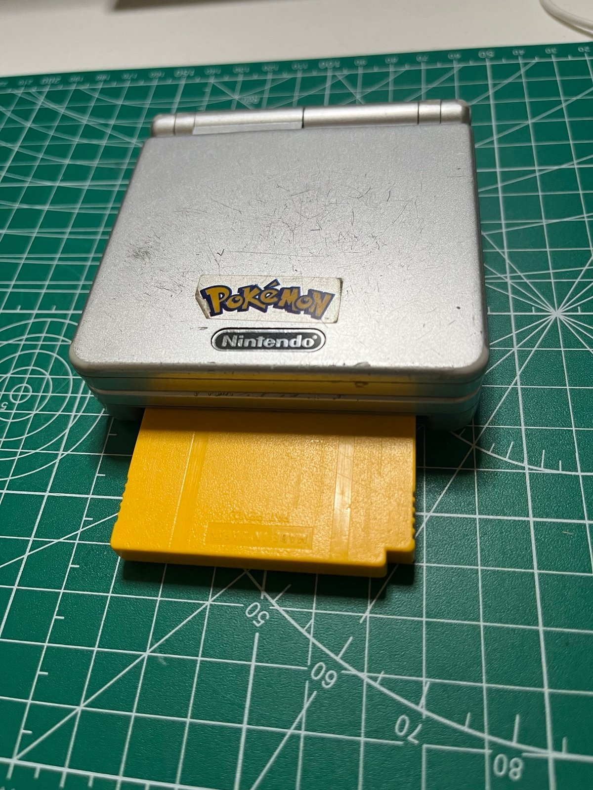 Gameboy Advance SP with Authentic Pokémon Yellow version