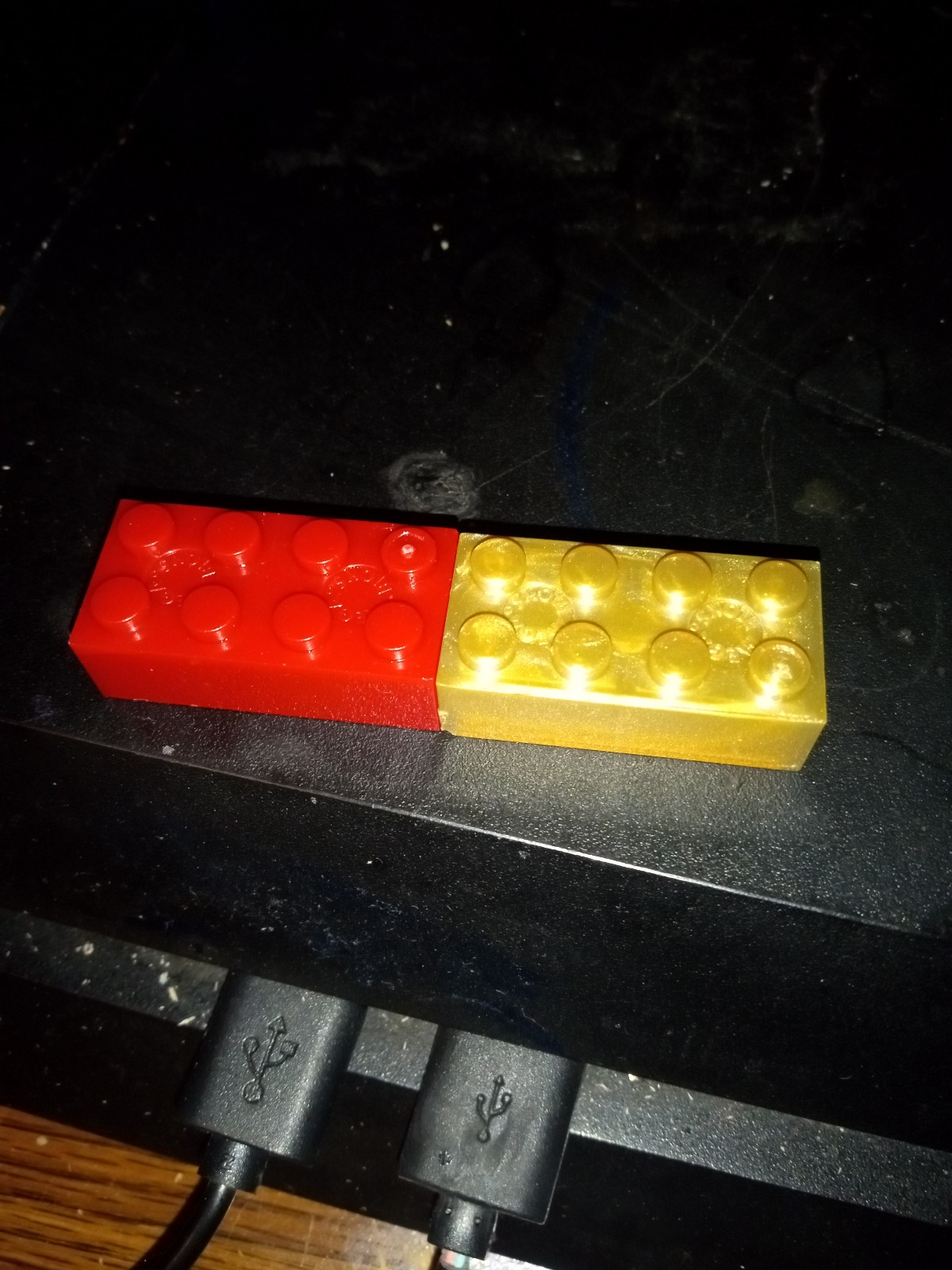 Two gold and red Lego blocks rare