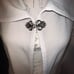 Patricia Nash,faux leather woven cape slit long sleeves jeweled clasp neckline