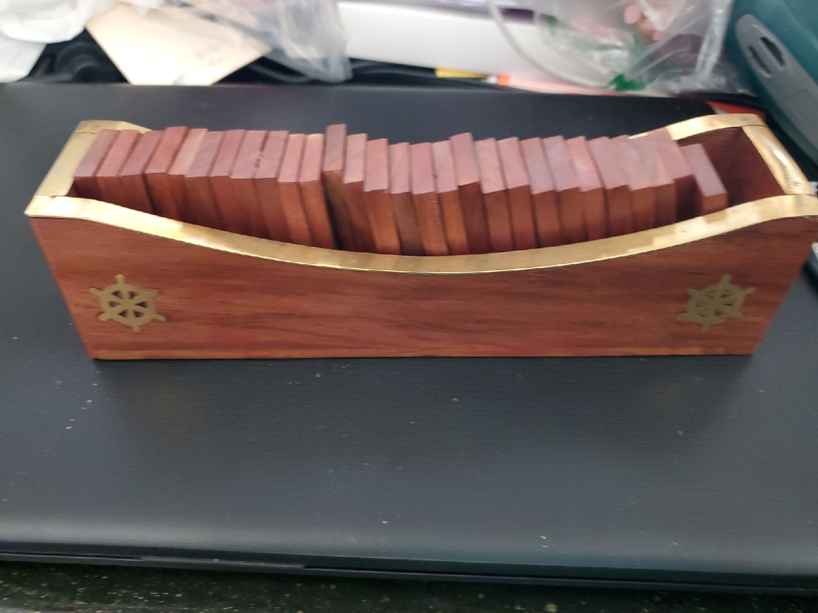 Wooden boat with 28 dominos