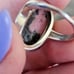 10k white gold rhodonite ring size 5 1/4. It measures between 5.5 and 5.25 on my