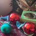 Lot of 3 vintage rubber elf head Christmas ornaments, setting on satin balls