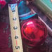 Lot of 3 vintage rubber elf head Christmas ornaments, setting on satin balls
