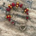 Red lamp work bead bracelet with silver and Swarovski crystals