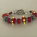 Red lamp work bead bracelet with silver and Swarovski crystals