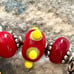 Red lamp work bead bracelet with silver and Swarovski crystals