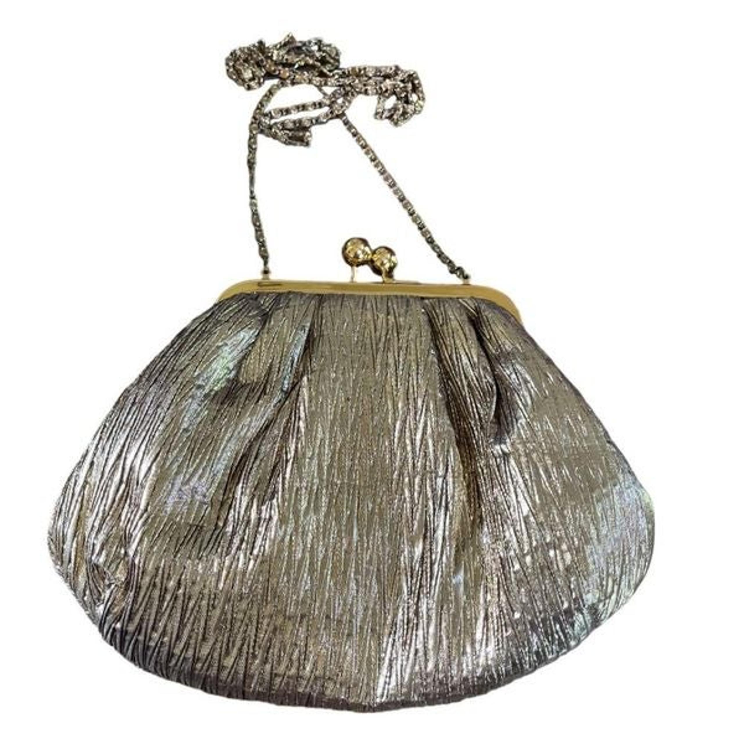 Pre-loved pleated fabric gold tone framed clutch with chain cross body strap.