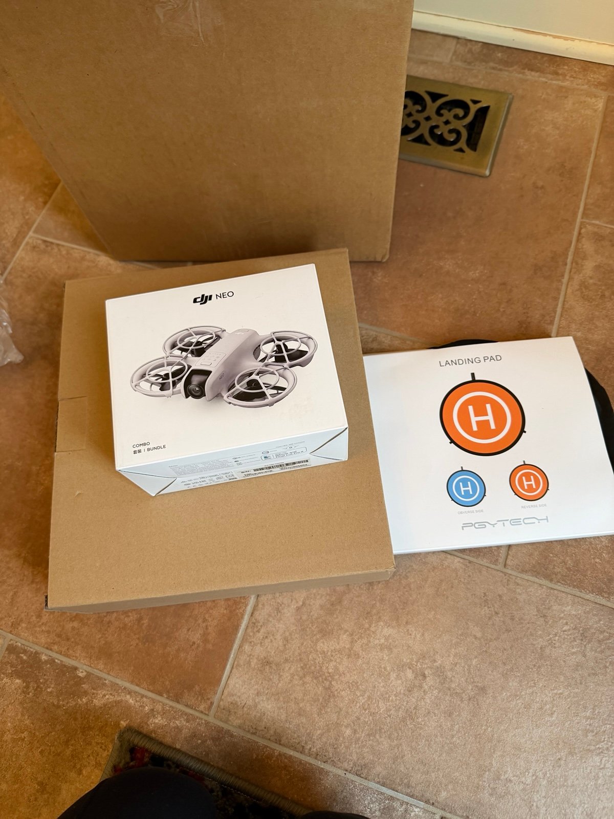 Drone with landing pad and charger