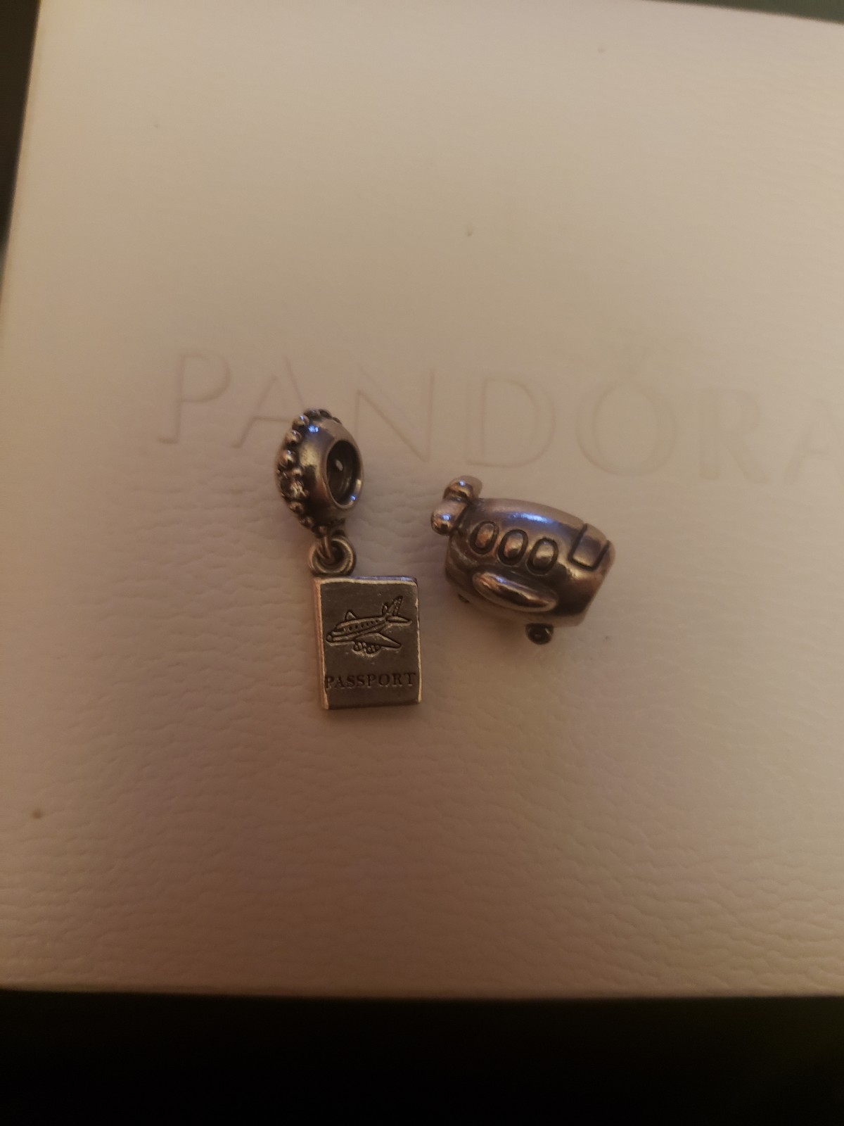 Pandora passport and airplane charms