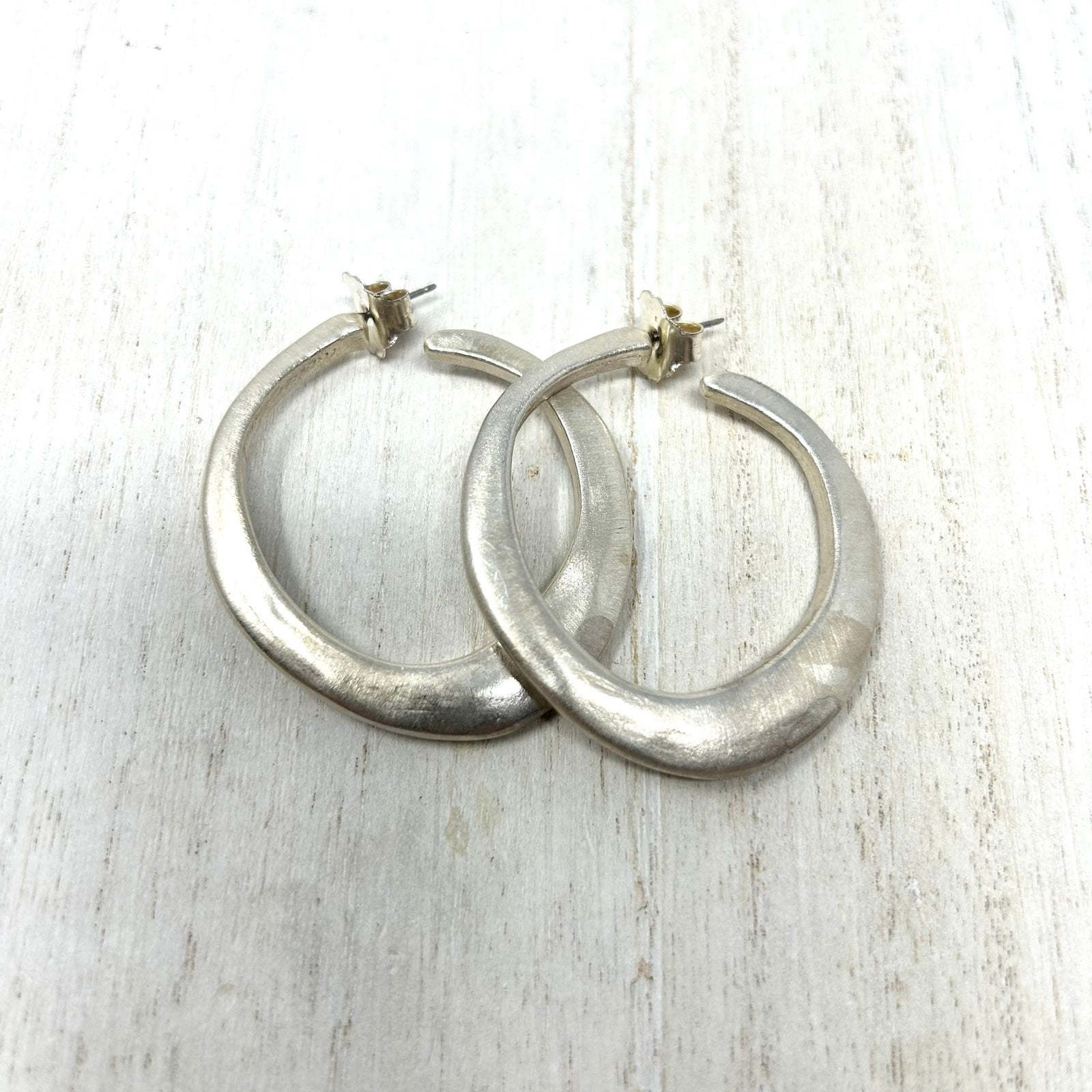 Sterling silver, brushed matte finish, artisan signed large hoop earrings