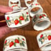 10 vintage porcelain strawberry napkin rings by Avon MINT condition