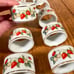 10 vintage porcelain strawberry napkin rings by Avon MINT condition