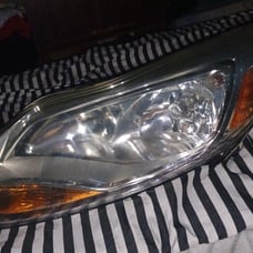 Headlight replacement part # BM5Z13008K