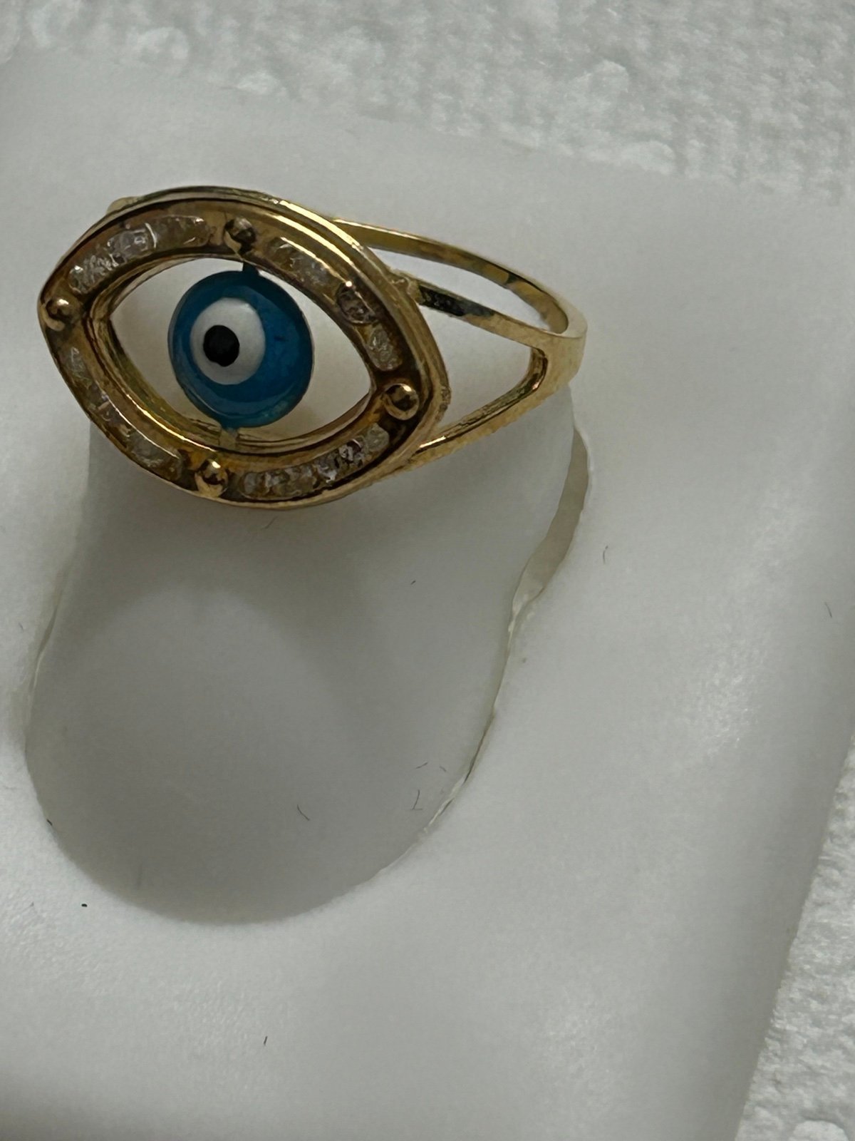 10k solid yellow gold ring with white CZ and evil light blue eye