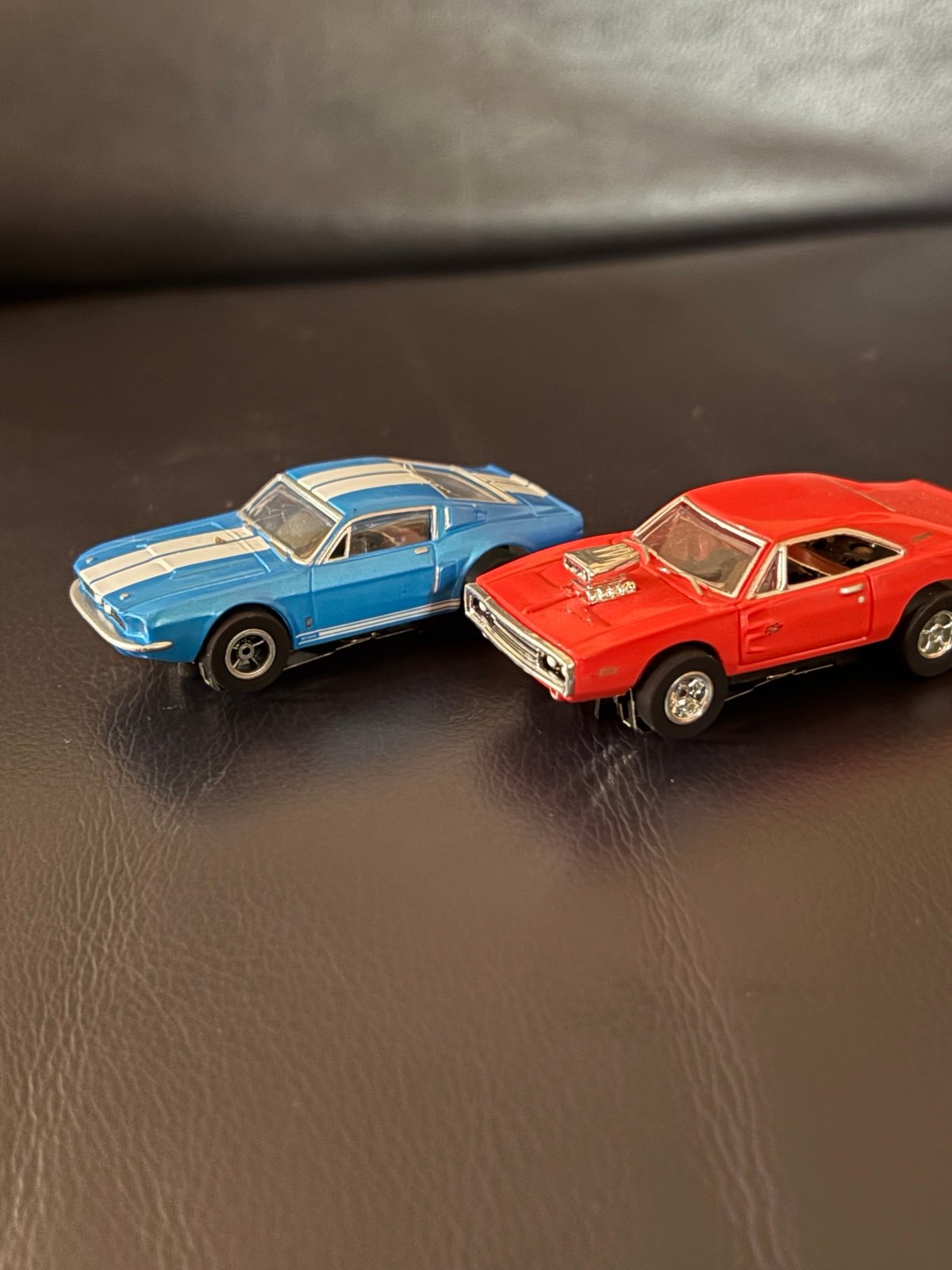 Two HO scale slot cars from the Auto World Country Charger Chase slot car set