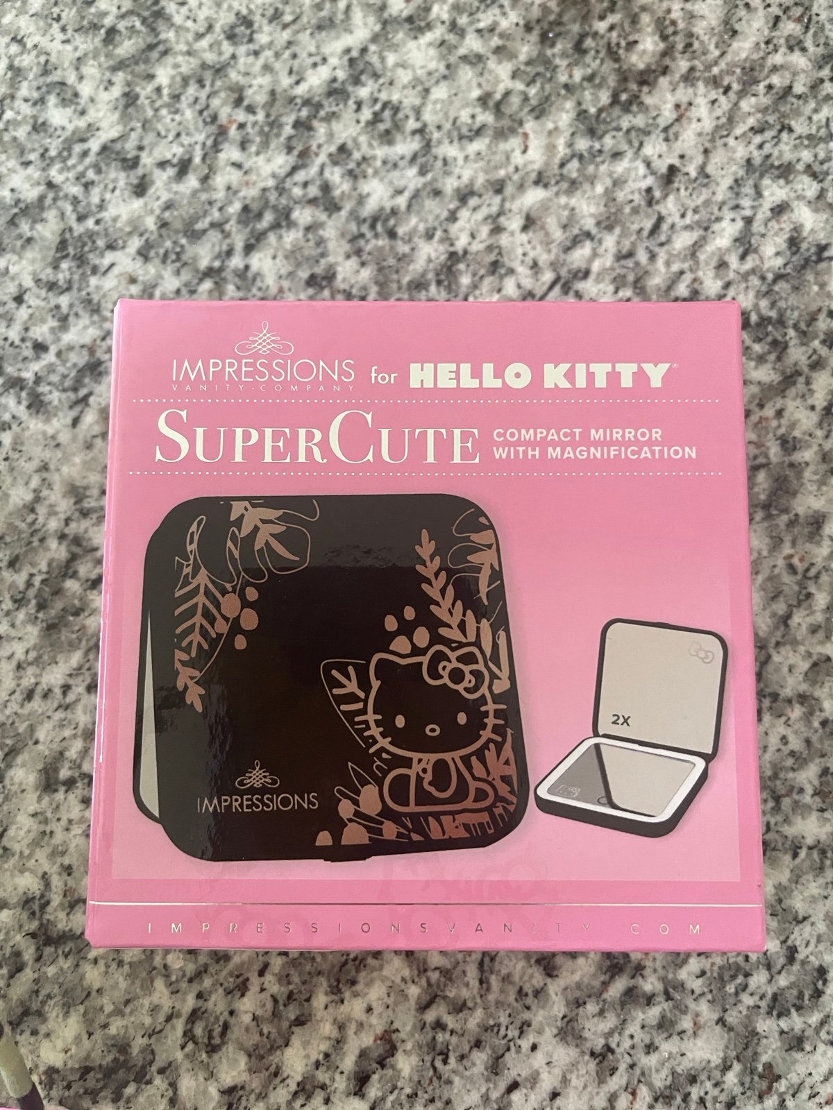 IMPRESSIONS FOR HELLO KITTY COMPACT MIRROR WITH MAGNIFICATION.