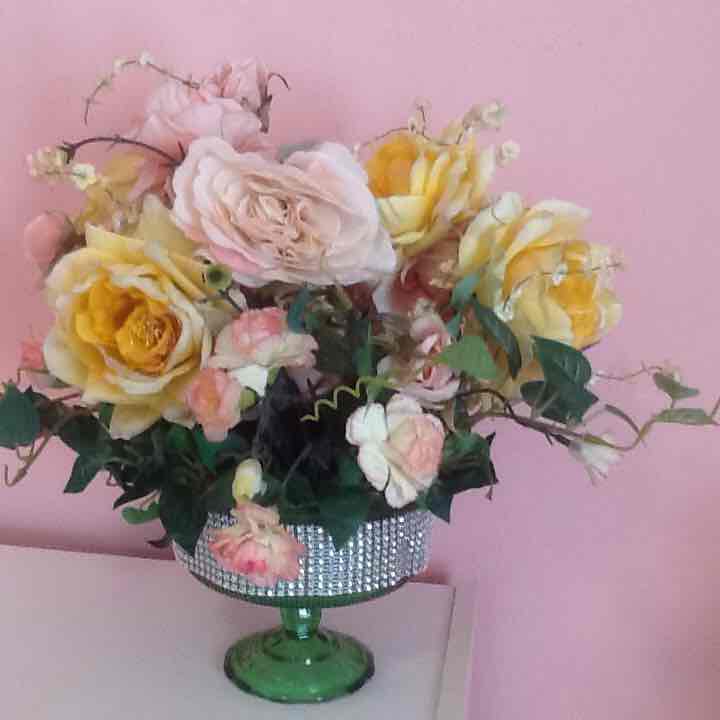 Artificial flowers with green vase