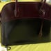 black maroon leather purse with handles