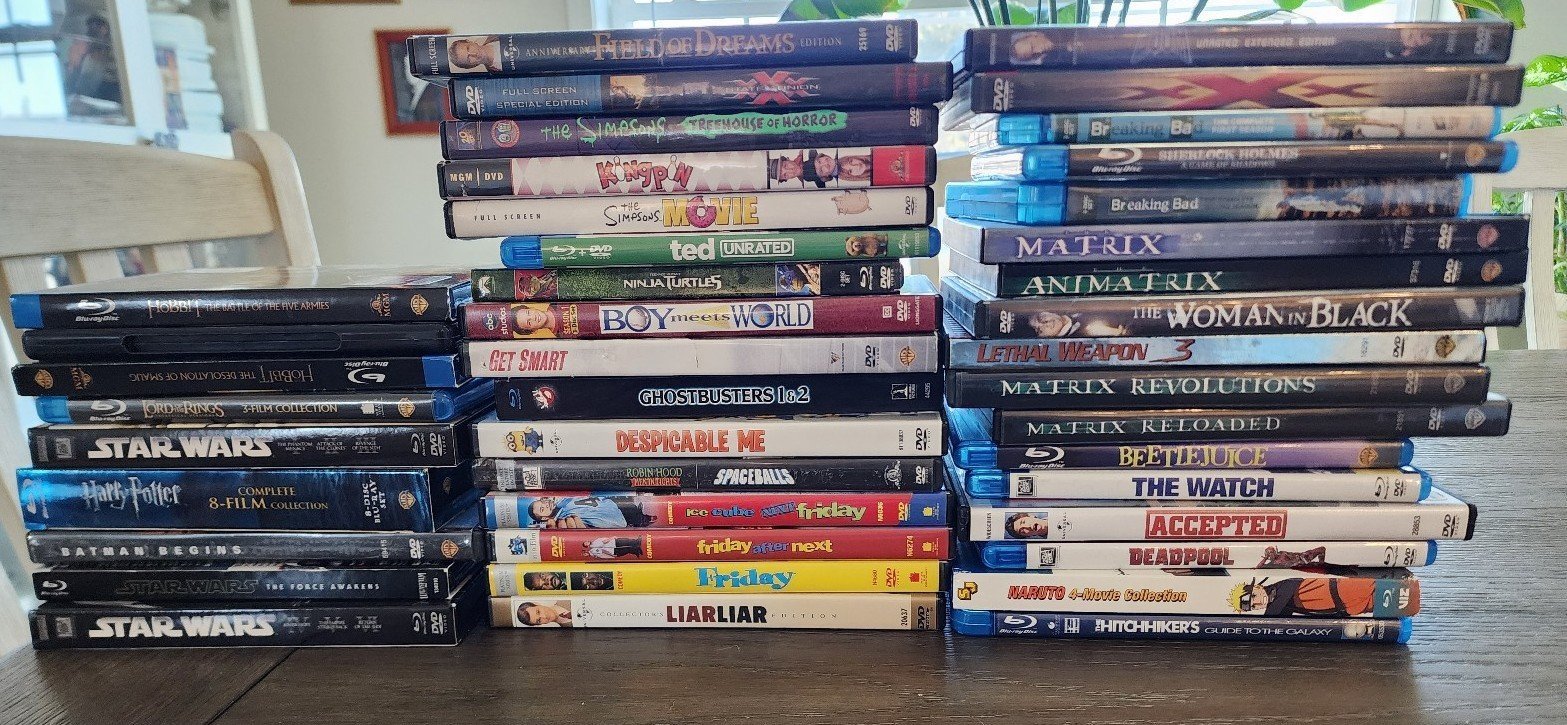 DVD 42 Movies Variety of Tittles In Cases Science Fiction, Comedy, Adventure