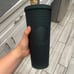 Dark green studeed starbucks cup