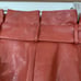 Revolve Majorelle terracotta brown faux leather pants,belt, pleated waist, XS