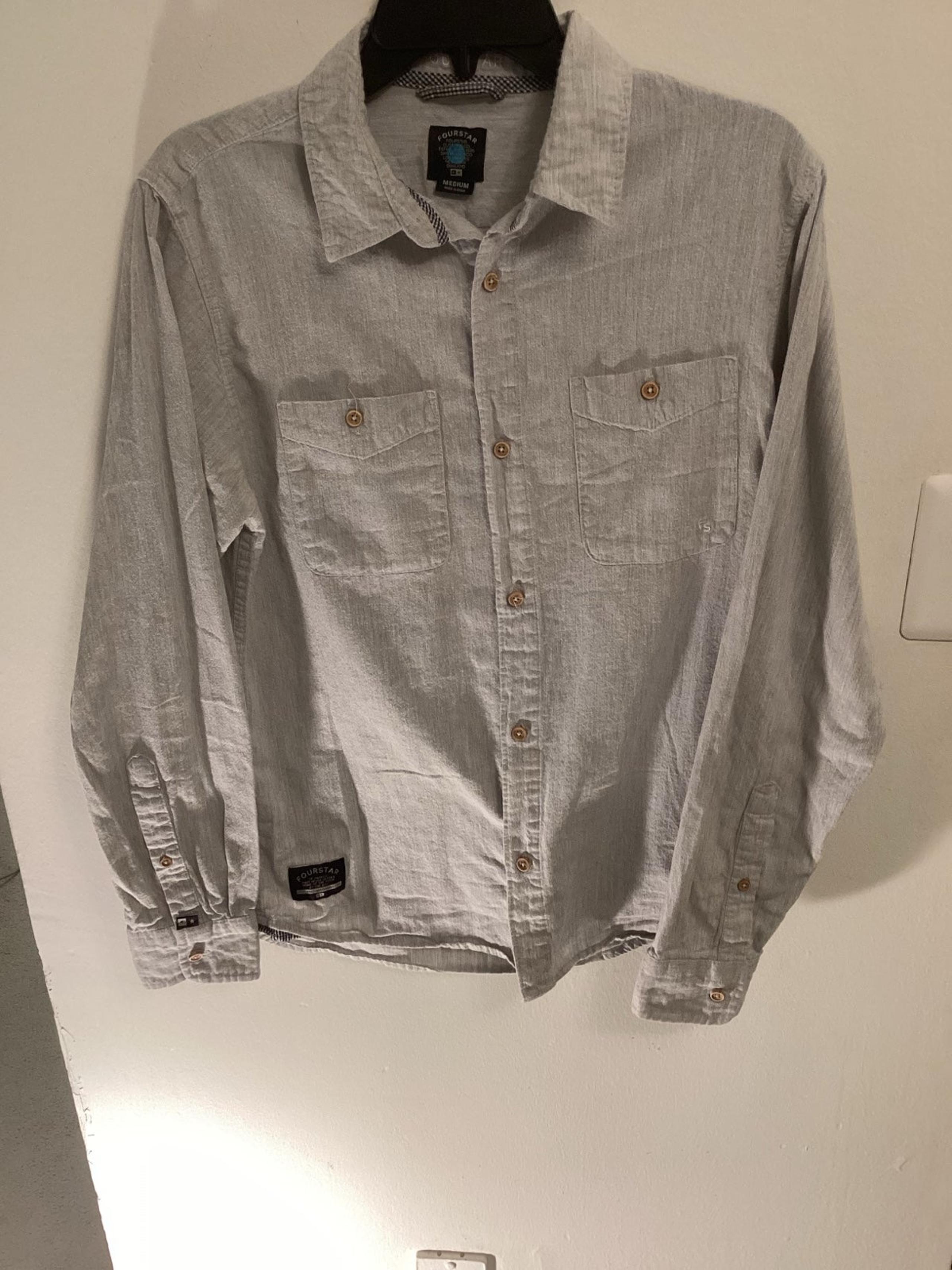 Four star long sleeve shirt in good condition women size medium