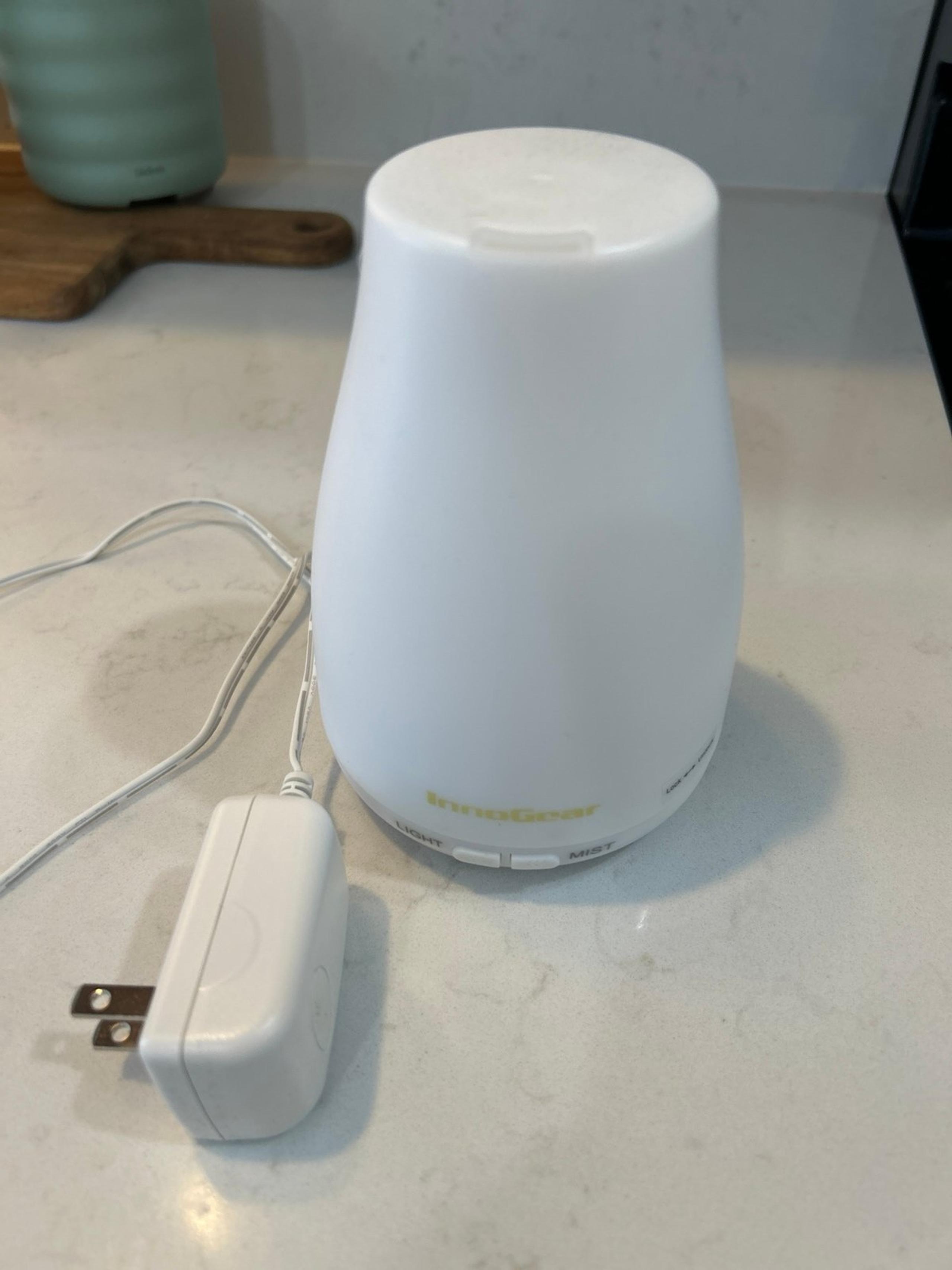 Oil diffuser, smaller white, like new condition, plugs in, about 6” tall