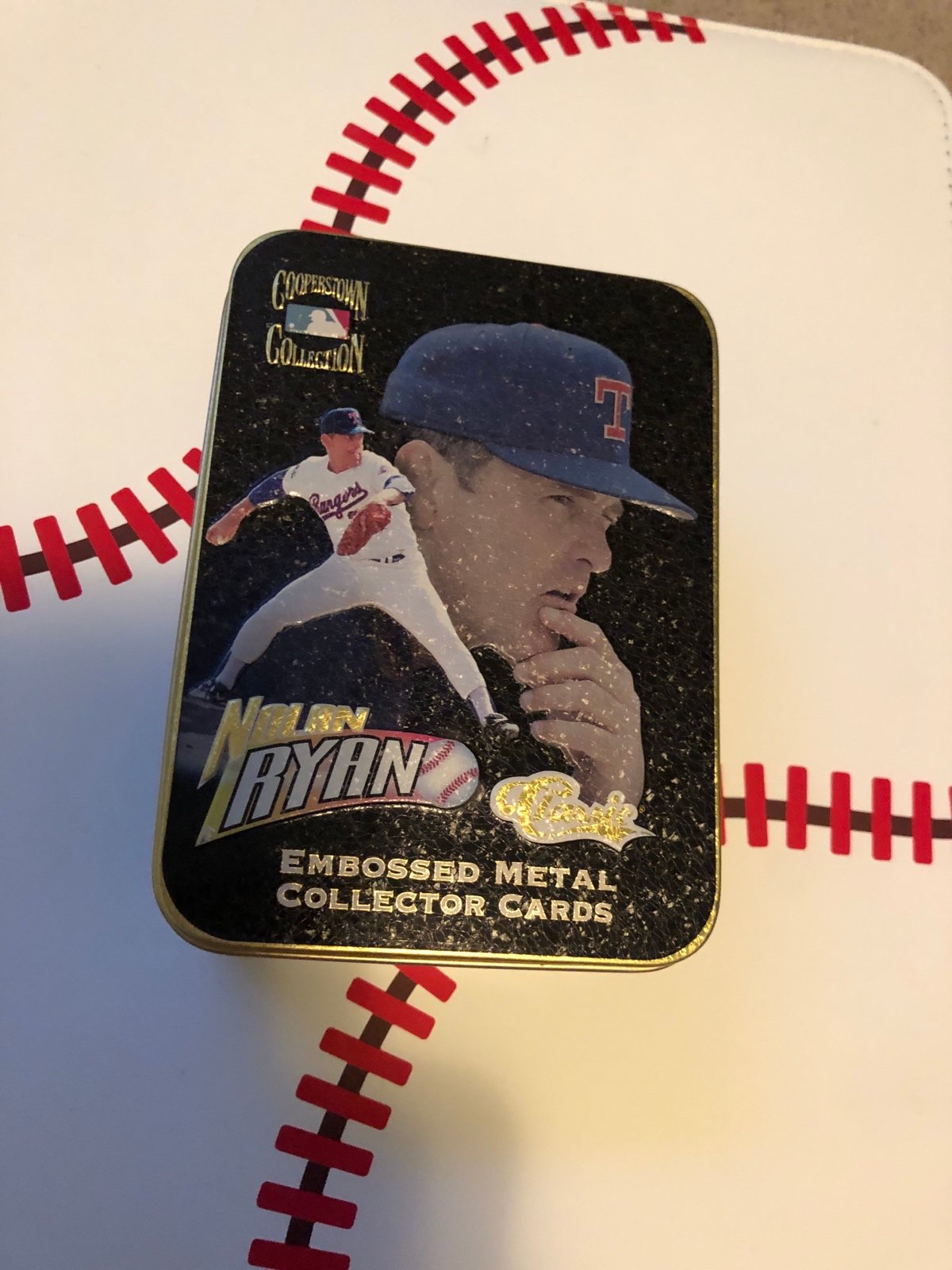 Nolan Ryan embossed metal cards in a tin it’s a total 5 cards