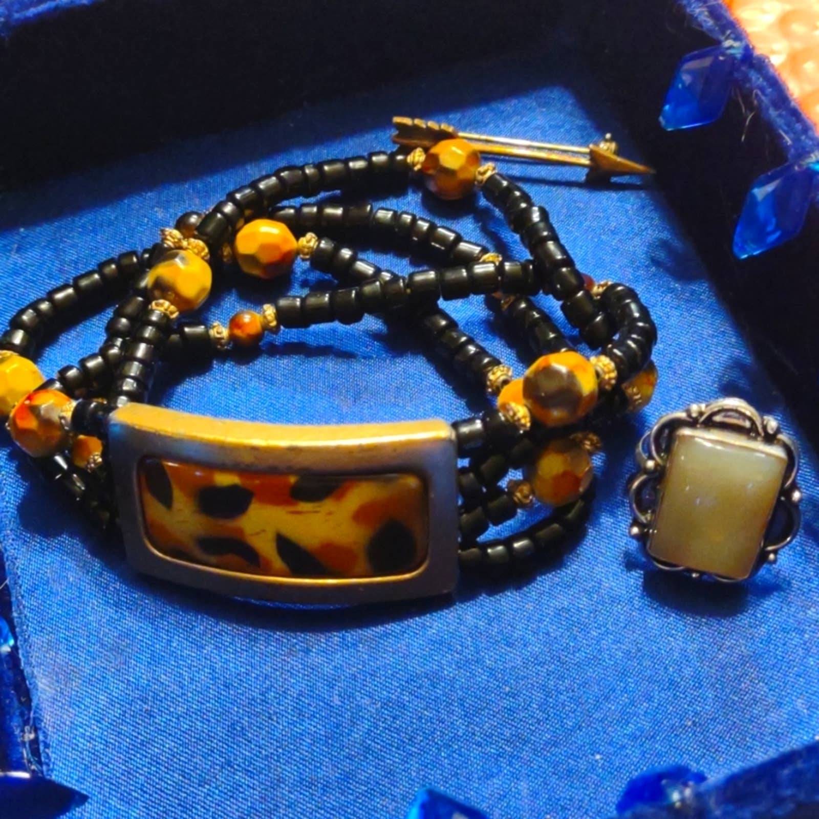 Vintage cheetah bracelet~sterling silver ring, and old arrow brooch.