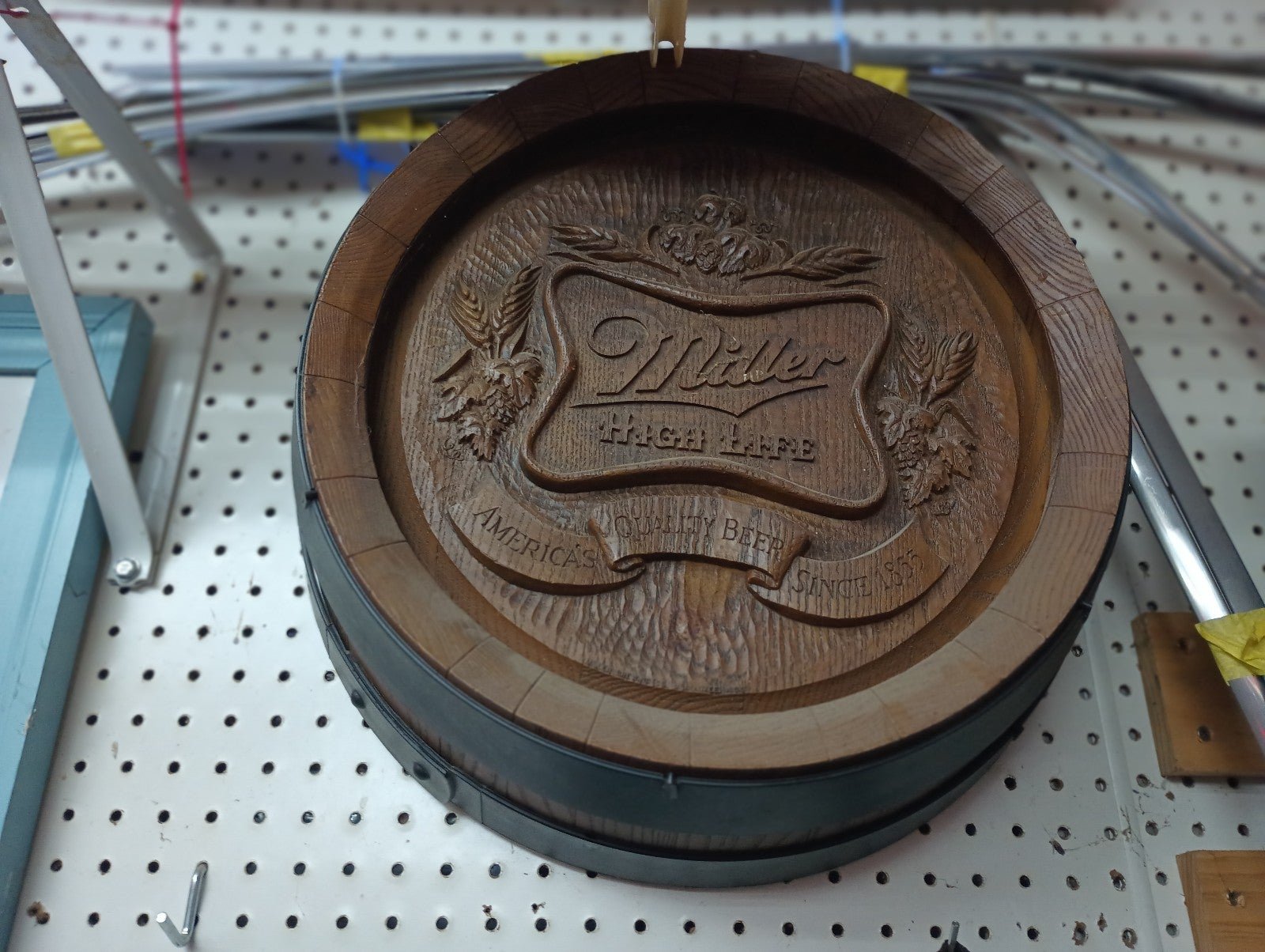 Vintage keg-like miller high life marketing sign