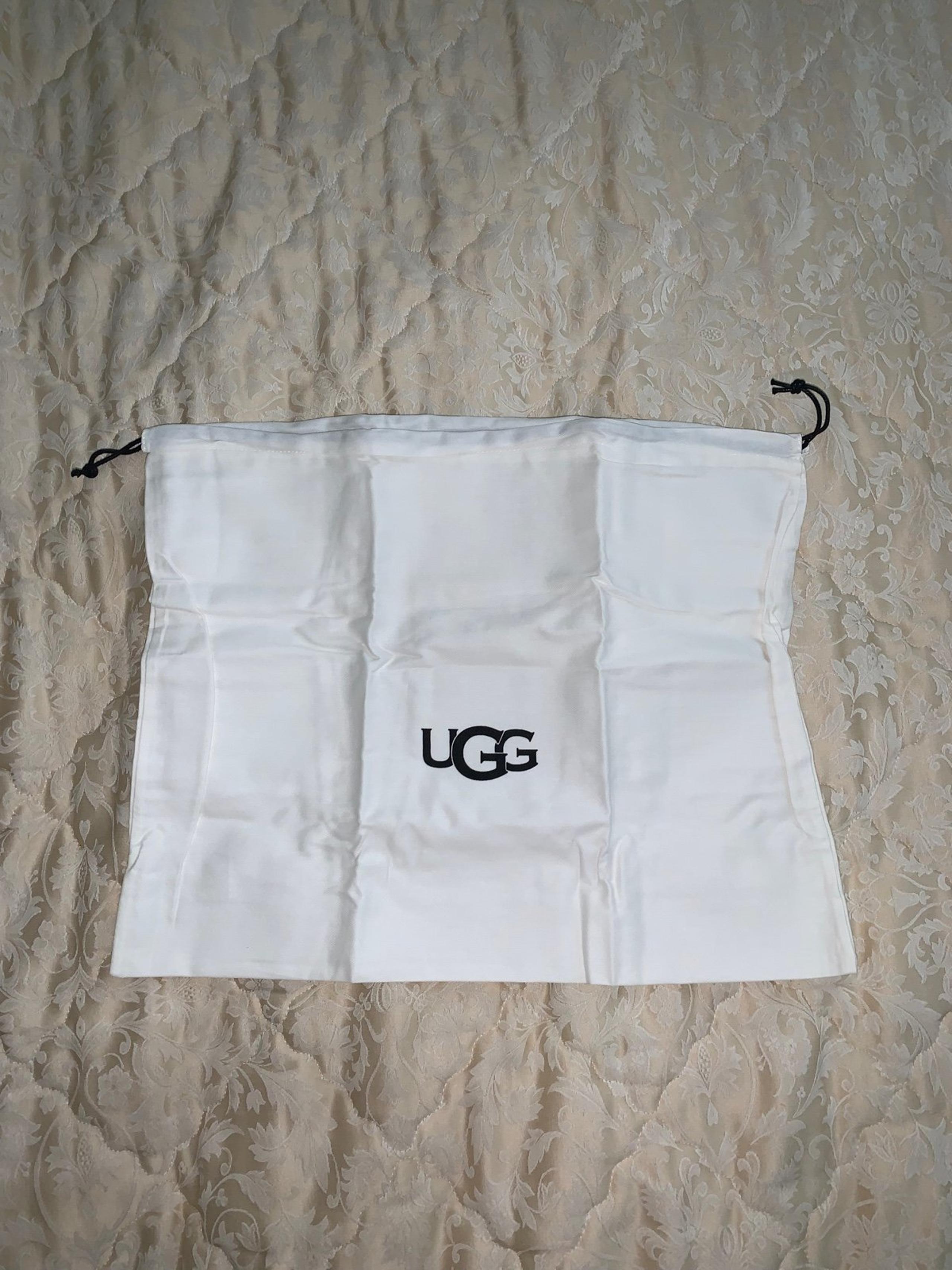 Ugg cream and black drawstring bag cover