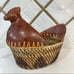 Hand woven rattan wicker chicken basket with wooden chicken head and tail.