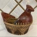 Hand woven rattan wicker chicken basket with wooden chicken head and tail.