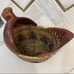 Hand woven rattan wicker chicken basket with wooden chicken head and tail.