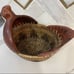 Hand woven rattan wicker chicken basket with wooden chicken head and tail.