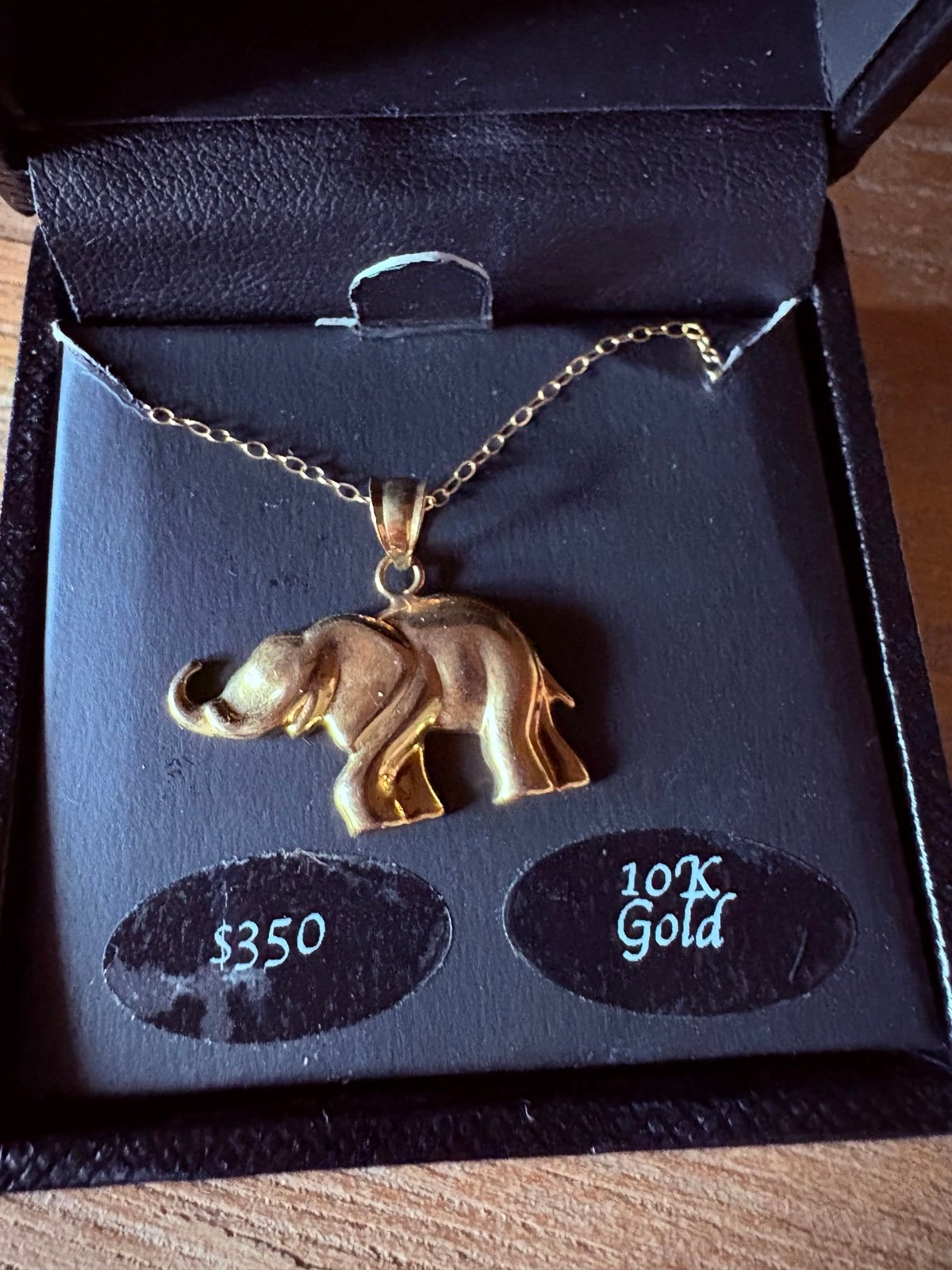 10k yellow gold elephant necklace.