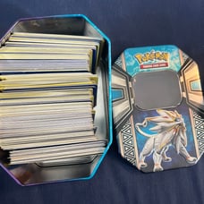 Tin full of random Pokémon cards