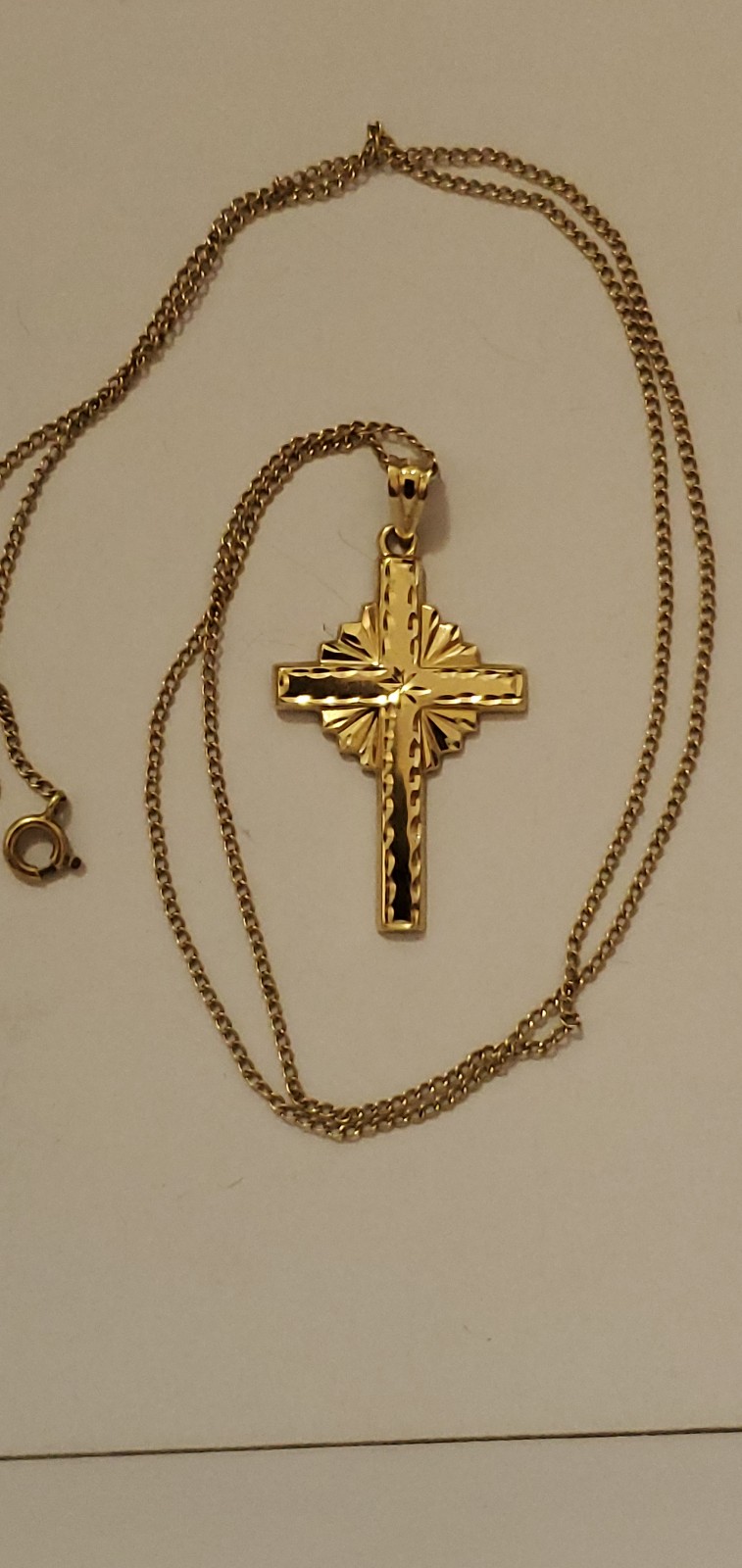 10k gold cross necklace with 14k gold chain.