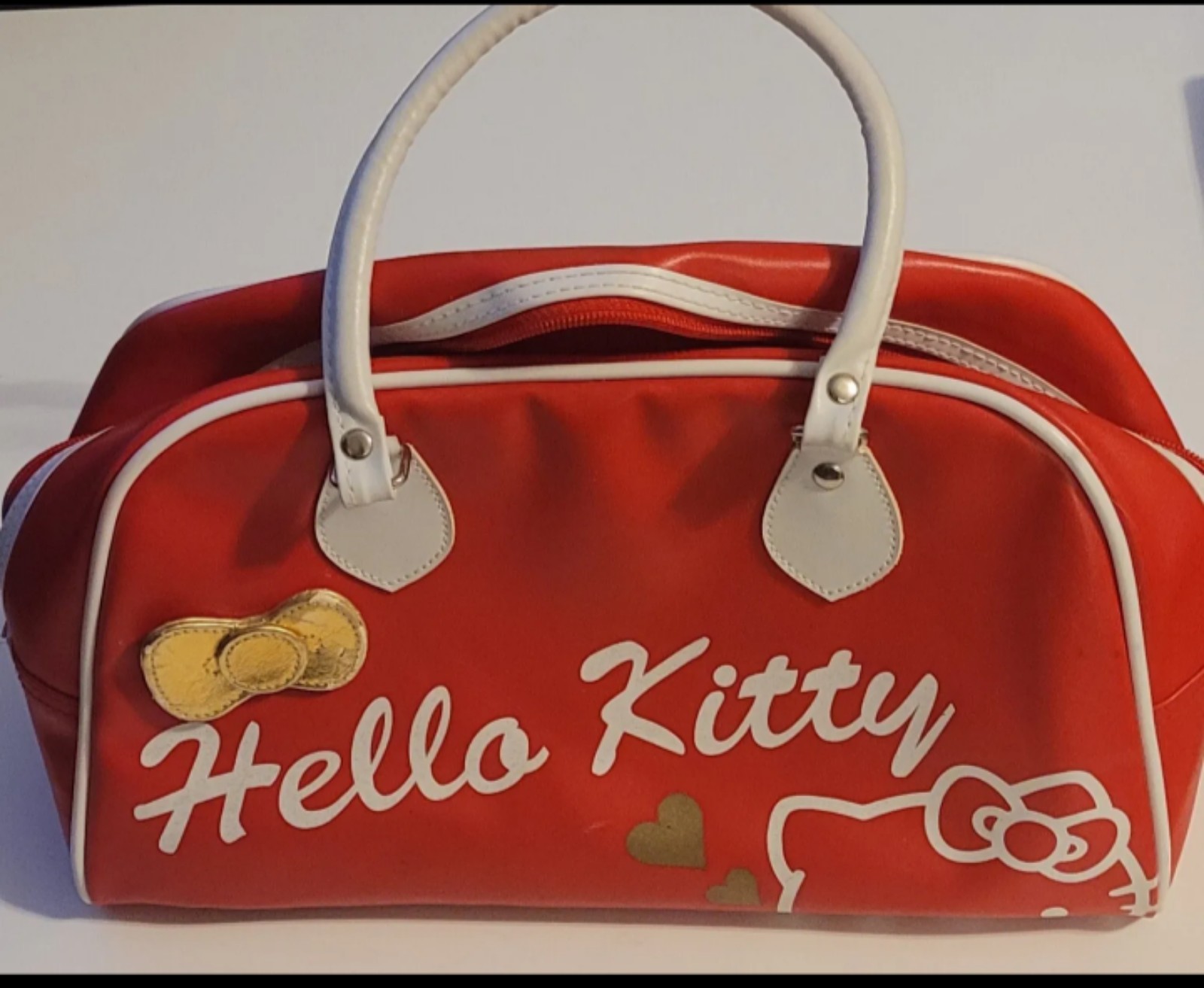 red hello kitty bowling bag style purse