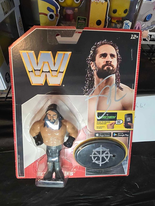 Seth Rollins Signed WWE Retro Style Figure (Comes with JSA Stapled To Card)