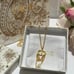 Gold triple tassel necklace