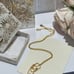 Gold triple tassel necklace
