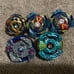 Beyblades; launchers; arenas